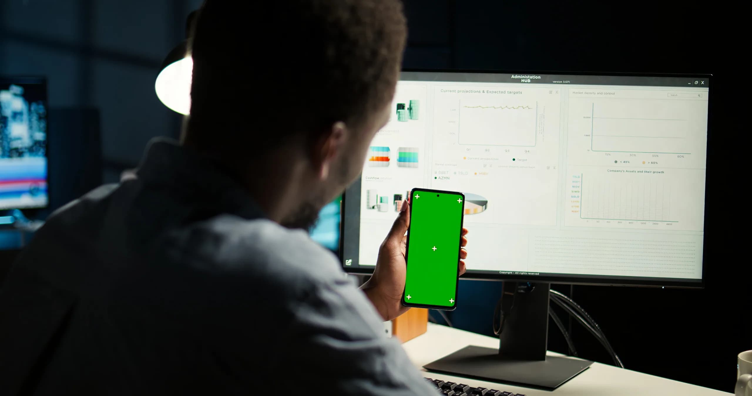 A finance manager running the monthly pay run on a desktop computer, the job HRMS payroll software has to get right