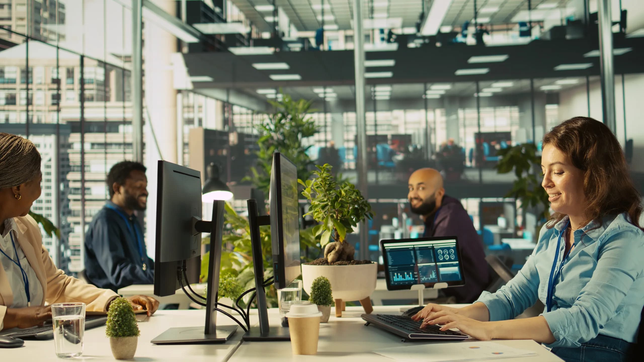 Colleagues reviewing figures together on screen