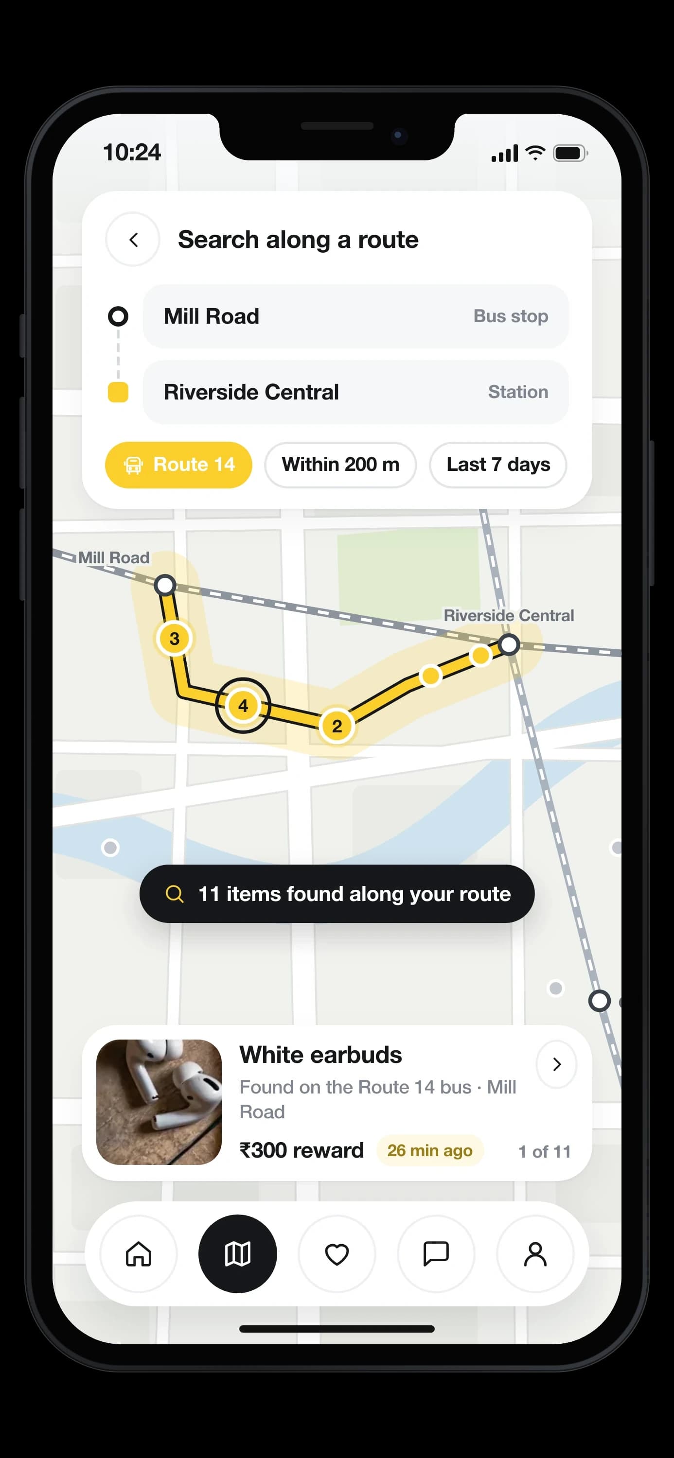 Search along a route: the Route 14 bus from Mill Road to Riverside Central, 11 items clustered along the corridor on the map, and white earbuds found on the bus docked at the bottom with a ₹300 reward — on an iPhone