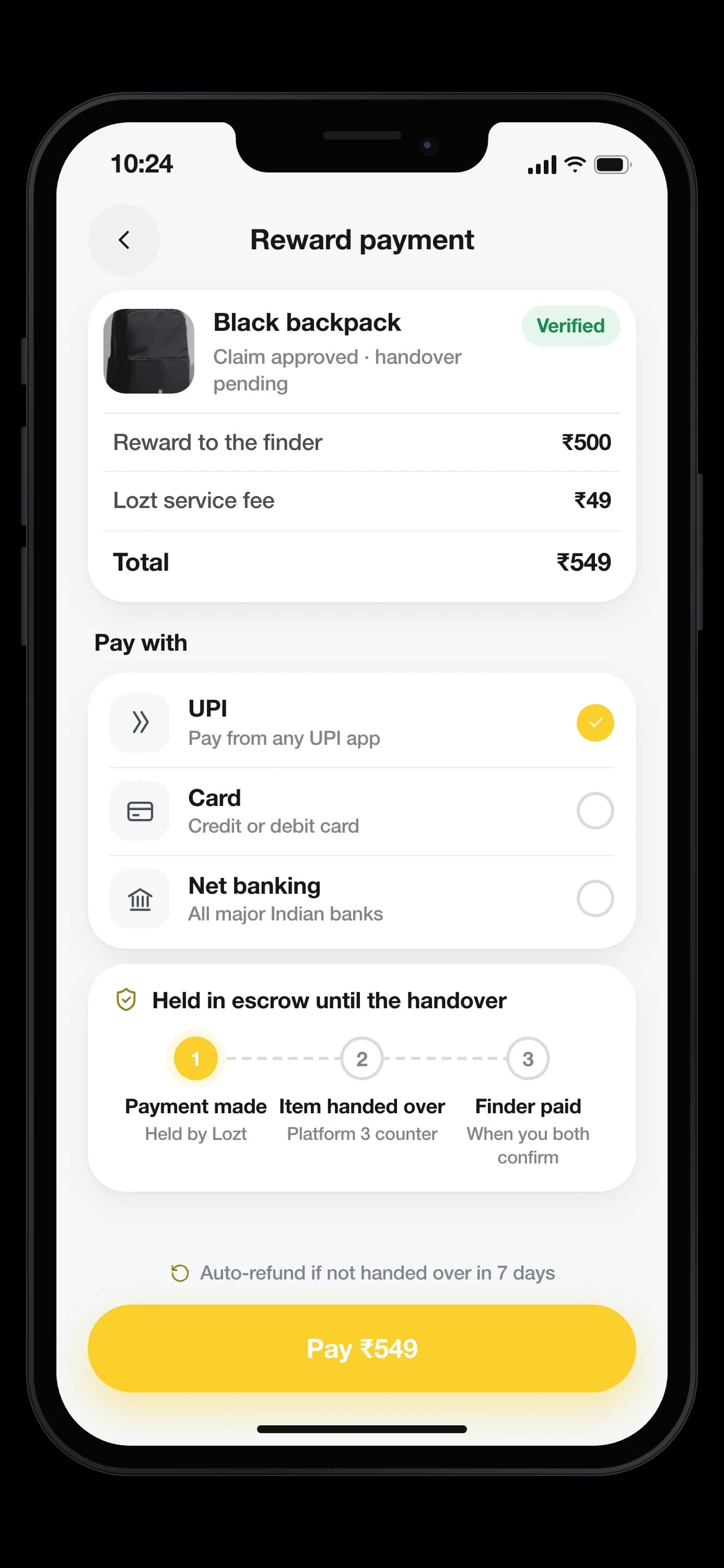 The reward payment for a black backpack: a ₹500 reward and a ₹49 service fee, ₹549 in all, by UPI, card or net banking, held in escrow from payment made through item handed over to finder paid, with an auto-refund after 7 days — on an iPhone